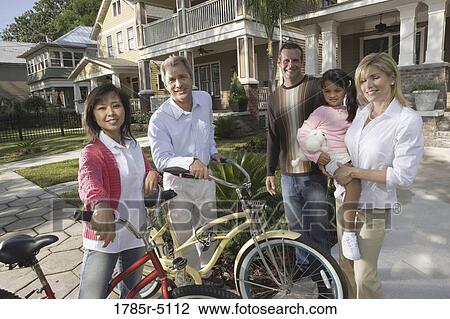 Family with young child standing with neighbors in front of house View Large Photo Image Stock Image - Family with young child standing with neighbors in front of house. Fotosearch