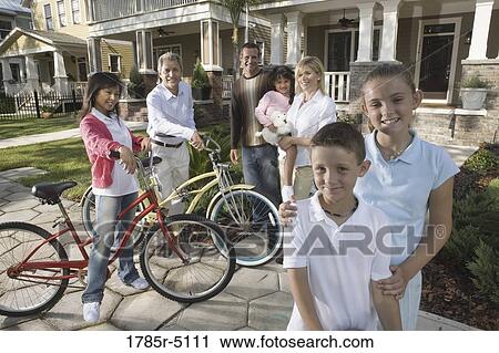 Family with young children standing with neighbors in front of house View Large Photo Image Stock Image - Family with young children standing with neighbors in front of house. Fotosearch