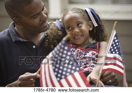 Father with daughter waving US flag View Large Photo Image Stock Image - Father with daughter waving US flag. Fotosearch