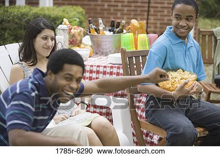 Friends and family at a picnic View Large Photo Image Stock Image - Friends and family at a picnic. Fotosearch