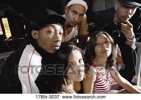 Group of young men and women in hip-hop fashion View Large Photo Image Stock Photo - Group of young men and women in hip-hop fashion. Fotosearch