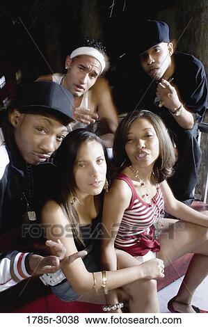 Group of young men and women in hip-hop fashion View Large Photo Image Stock Photo - Group of young men and women in hip-hop fashion. Fotosearch