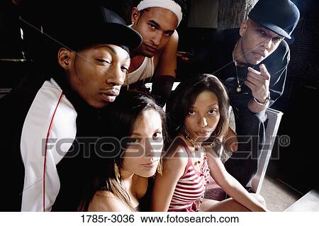 Stock Photograph - Group of young men and women in hip-hop fashion. Fotosearch
