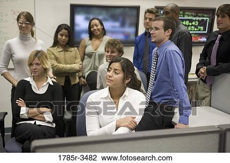 Group of young office workers together in meeting View Large Photo Image Stock Image - Group of young office workers together in meeting. Fotosearch
