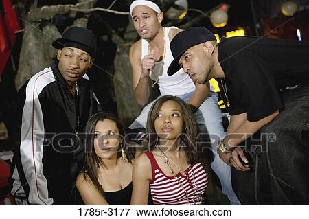 Group of young people in hip-hop fashion View Large Photo Image Stock Photo - Group of young people in hip-hop fashion. Fotosearch