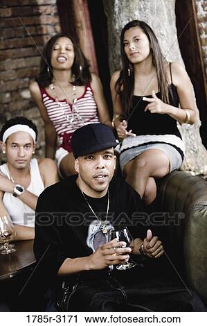 Group of young people partying at a nightclub View Large Photo Image Stock Image - Group of young people partying at a nightclub. Fotosearch