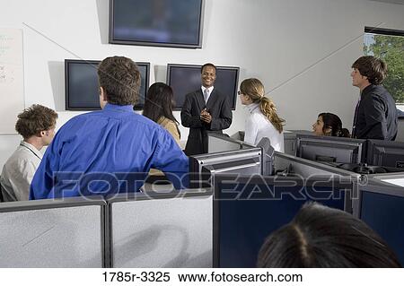 Group of young workers in office having meeting View Large Photo Image Stock Photography - Group of young workers in office having meeting. Fotosearch