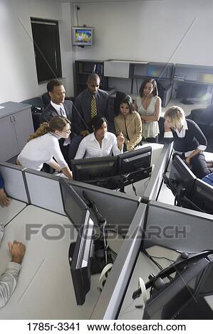 Group of young workers in office working on computers View Large Photo Image Stock Image - Group of young workers in office working on computers. Fotosearch