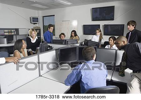 Group of young workers in office View Large Photo Image Stock Photo - Group of young workers in office. Fotosearch
