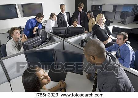 Group of young workers in office working on computers View Large Photo Image Stock Photo - Group of young workers in office working on computers. Fotosearch