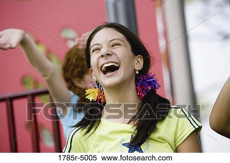 Head-shot of a happy and laughing girl View Large Photo Image Stock Photography - Head-shot of a happy and laughing girl. Fotosearch