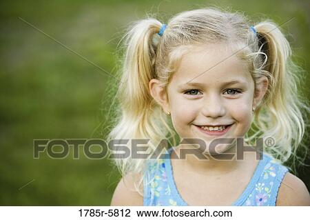 Head-shot of a smiling little girl View Large Photo Image Stock Image - Head-shot of a smiling little girl. Fotosearch