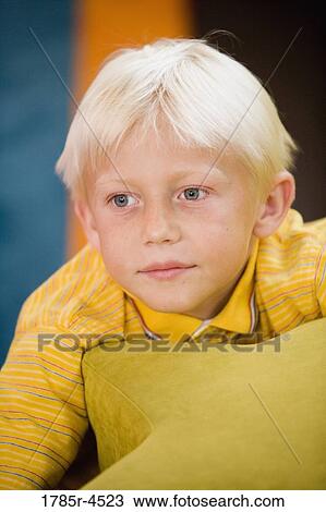 Head-shot of a young boy in a colorful room View Large Photo Image Stock Image - Head-shot of a young boy in a colorful room. Fotosearch