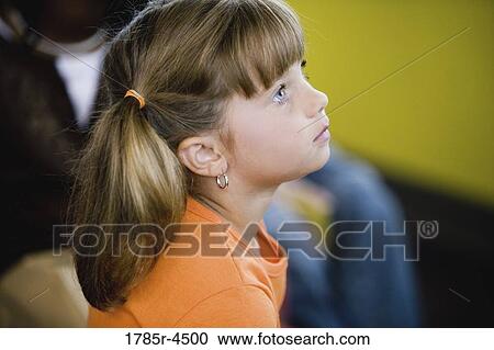Stock Image - Head-shot of a young girl. Fotosearch