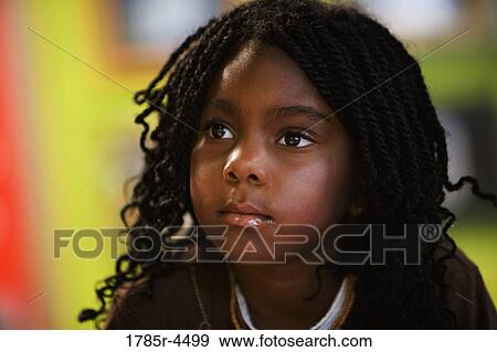 Head-shot of a young girl View Large Photo Image Stock Photo - Head-shot of a young girl. Fotosearch