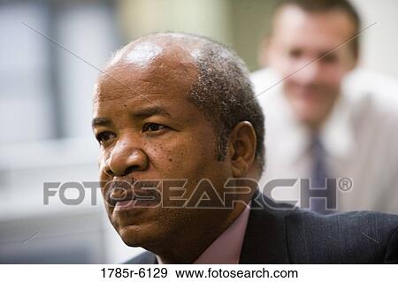 Head-shot of contemplative businessman View Large Photo Image Stock Photo - Head-shot of contemplative businessman. Fotosearch