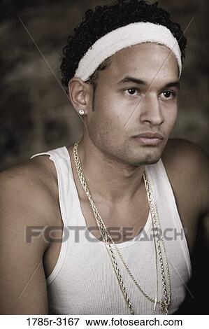 Stock Photo - Head-shot of young man in hip-hop fashion. Fotosearch