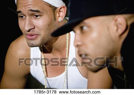 Stock Photo - Head-shot of young men in hip-hop fashion. Fotosearch