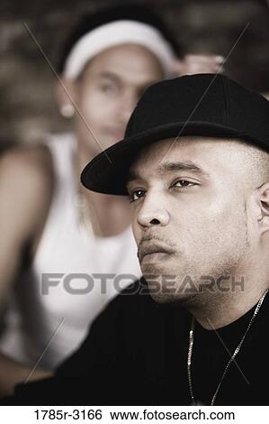 Head-shot of young men in hip-hop fashion View Large Photo Image Stock Photograph - Head-shot of young men in hip-hop fashion. Fotosearch