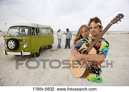 Hippies at the beach with guitar View Large Photo Image Stock Image - Hippies at the beach with guitar. Fotosearch
