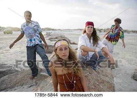 Hippies hanging out at the beach View Large Photo Image Picture - Hippies hanging out at the beach. Fotosearch