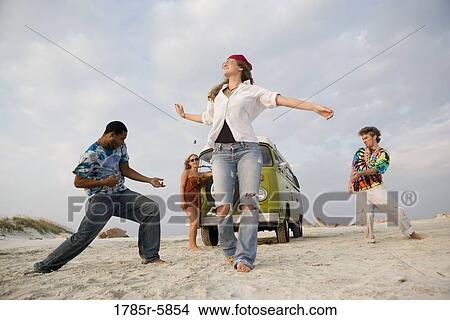 Hippies hanging out at the beach View Large Photo Image Picture - Hippies hanging out at the beach. Fotosearch