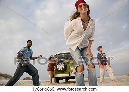 Hippies hanging out at the beach View Large Photo Image Stock Image - Hippies hanging out at the beach. Fotosearch