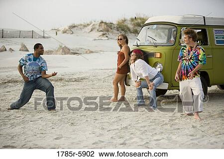 Hippies hanging out at the beach View Large Photo Image Stock Image - Hippies hanging out at the beach. Fotosearch