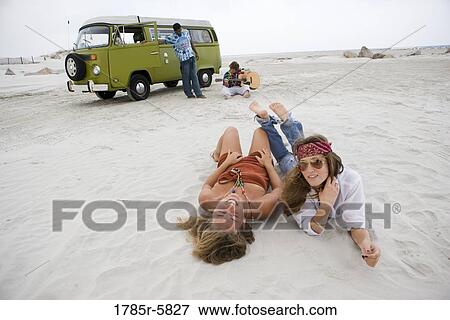 Hippies hanging out at the beach View Large Photo Image Stock Photo - Hippies hanging out at the beach. Fotosearch