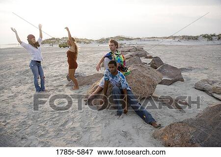 Hippies hanging out at the beach View Large Photo Image Stock Photo - Hippies hanging out at the beach. Fotosearch