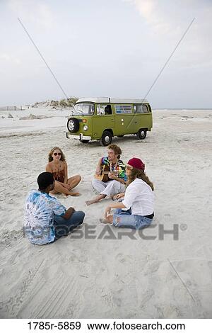 Hippies hanging out at the beach View Large Photo Image Stock Photo - Hippies hanging out at the beach. Fotosearch