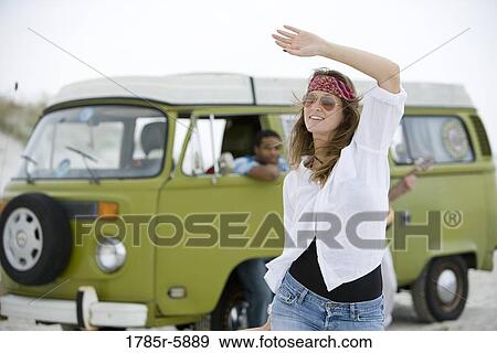 Stock Photo - Hippies hanging out at the beach. Fotosearch