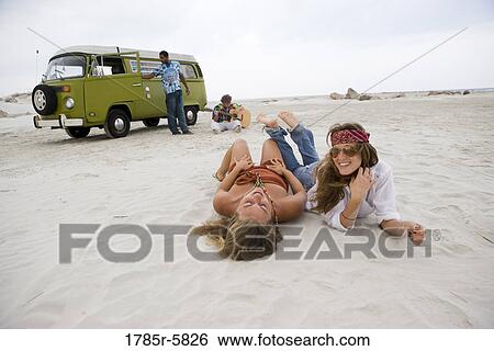 Hippies hanging out at the beach View Large Photo Image Stock Photograph - Hippies hanging out at the beach. Fotosearch