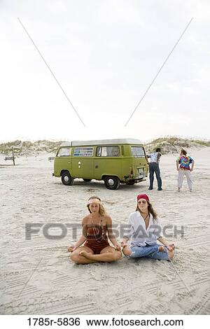 Hippies hanging out at the beach View Large Photo Image Stock Photograph - Hippies hanging out at the beach. Fotosearch