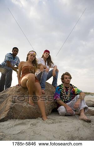 Hippies hanging out at the beach View Large Photo Image Stock Photograph - Hippies hanging out at the beach. Fotosearch