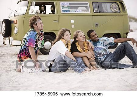 Hippies hanging out at the beach View Large Photo Image Stock Photography - Hippies hanging out at the beach. Fotosearch