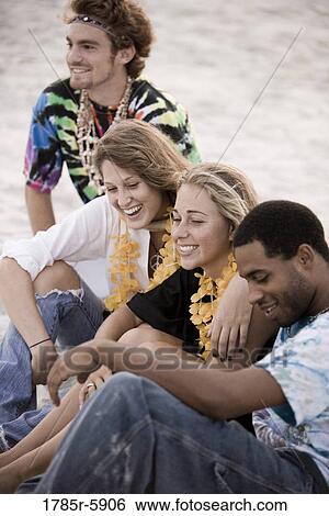 Hippies hanging out together View Large Photo Image Stock Photograph - Hippies hanging out together. Fotosearch