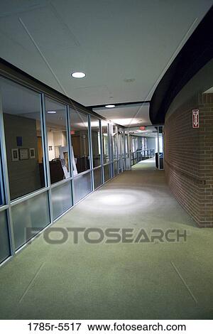 Interior view of an empty office hallway View Large Photo Image Stock Photo - Interior view of an empty office hallway. Fotosearch