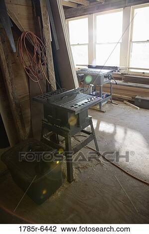 Stock Image - Interior view of tool shed with carpentry tools. Fotosearch