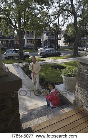 Interracial couple on front walkway of their house View Large Photo Image Stock Photo - Interracial couple on front walkway of their house. Fotosearch