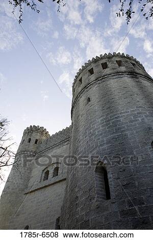 Low angle view of a castle and turrets against the sky View Large Photo Image Stock Photo - Low angle view of a castle and turrets against the sky. Fotosearch