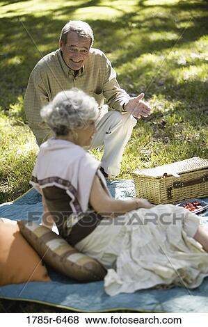 Stock Photo - Mature couple having a picnic. Fotosearch