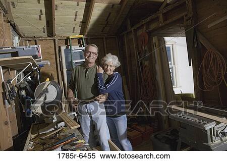 Stock Photography - Mature couple in toolshed. Fotosearch