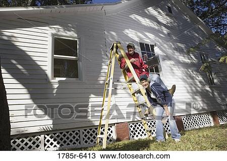 Mature couple with ladder and painting tools preparing to paint outside of house View Large Photo Image Stock Image - Mature couple with ladder and painting tools preparing to paint outside of house. Fotosearch