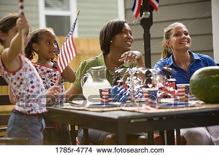 Mothers and daughters celebrating 4th of July View Large Photo Image Picture - Mothers and daughters celebrating 4th of July. Fotosearch