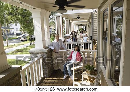 Next-door neighbors on front porches View Large Photo Image Stock Photograph - Next-door neighbors on front porches. Fotosearch