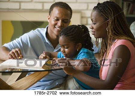 Parents coloring with daughter View Large Photo Image Stock Image - Parents coloring with daughter. Fotosearch