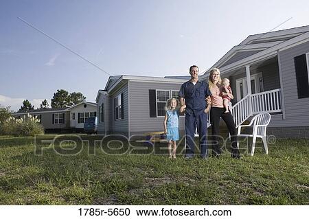 Portrait of a blue-collar family in front of a trailer home View Large Photo Image Stock Image - Portrait of a blue-collar family in front of a trailer home. Fotosearch