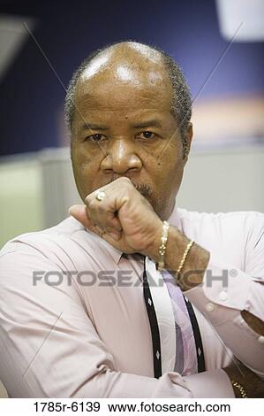 Portrait of a contemplative mature businessman View Large Photo Image Stock Photo - Portrait of a contemplative mature businessman. Fotosearch