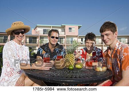 Portrait of a family enjoying tropical vacation View Large Photo Image Picture - Portrait of a family enjoying tropical vacation. Fotosearch